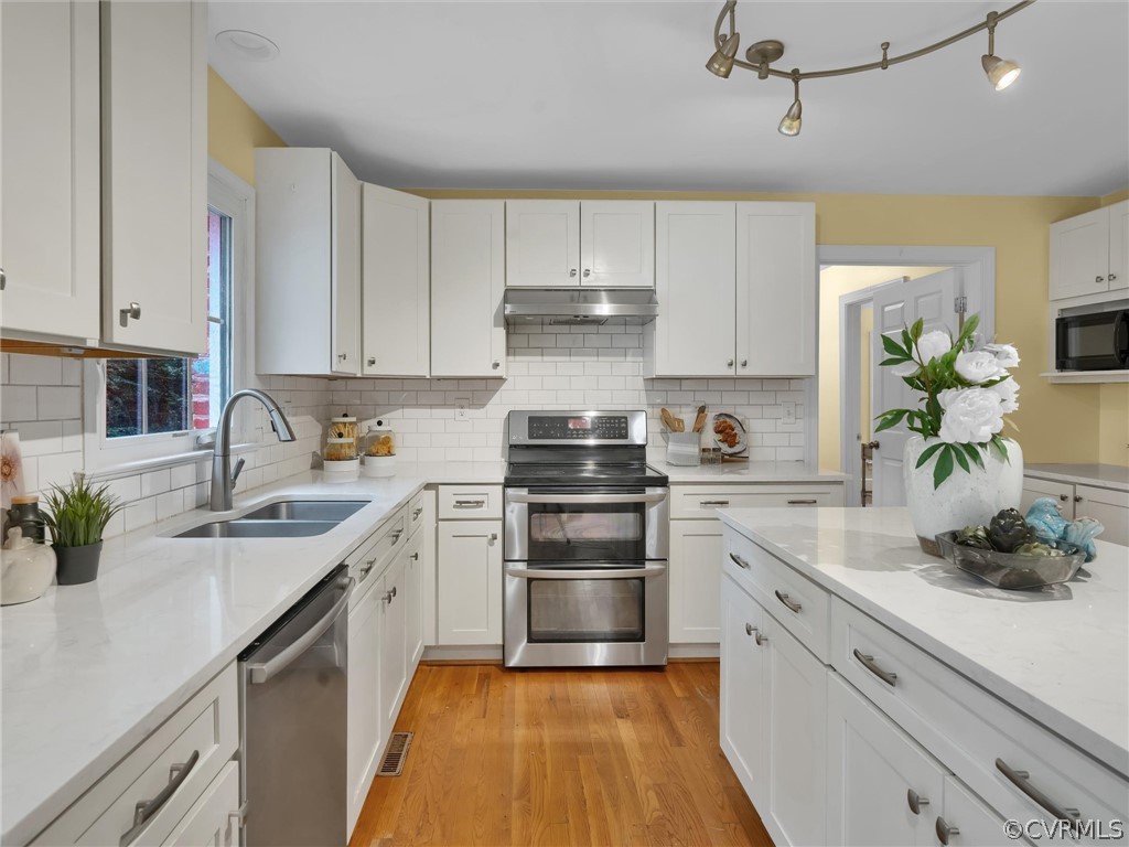 12100 2nd Branch Road Chesterfield, VA 23838 - Photo 9 of 41 a kitchen with a sink stove and cabinets