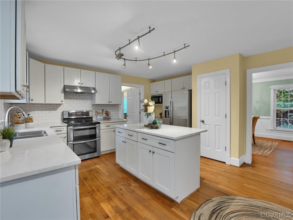 12100 2nd Branch Road Chesterfield, VA 23838 - Photo 10 of 41 a kitchen with stainless steel appliances granite countertop a sink stove and refrigerator