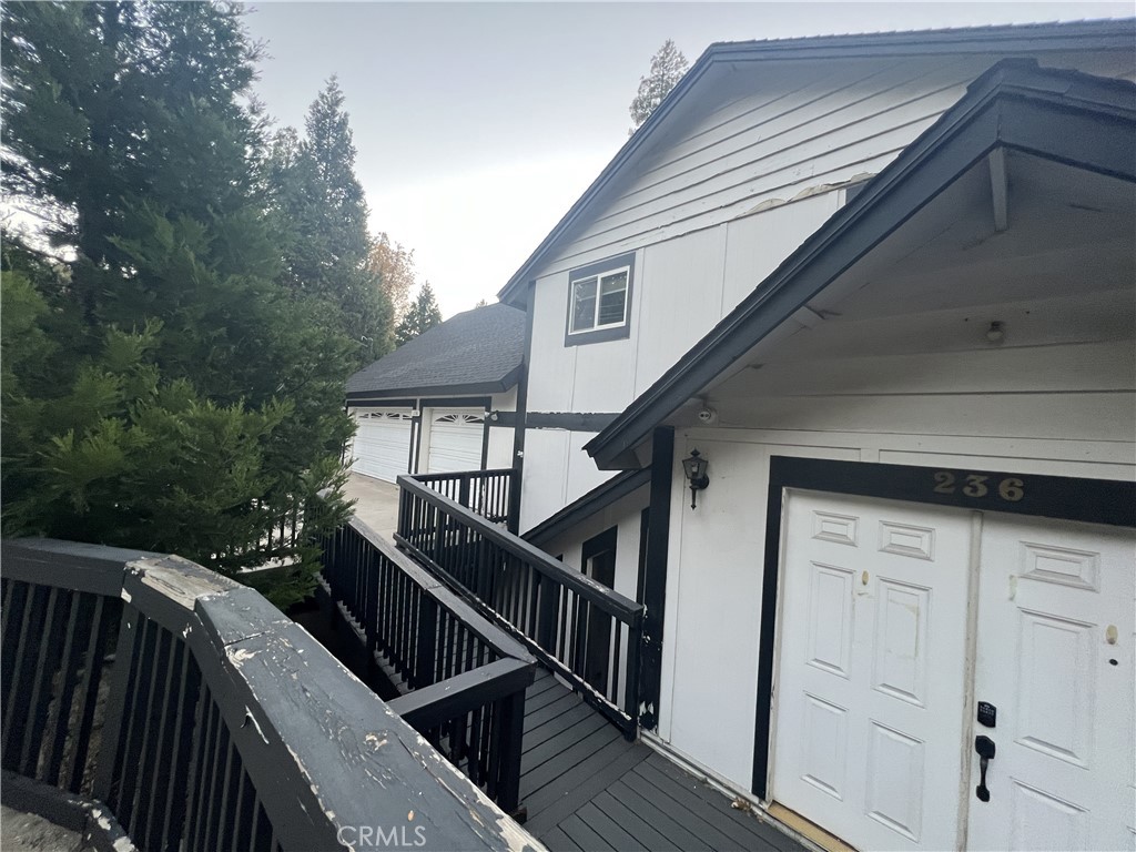 236 North Grass Valley Road Lake Arrowhead, CA 92352 - Photo 3 of 4 a house view with a deck and a backyard