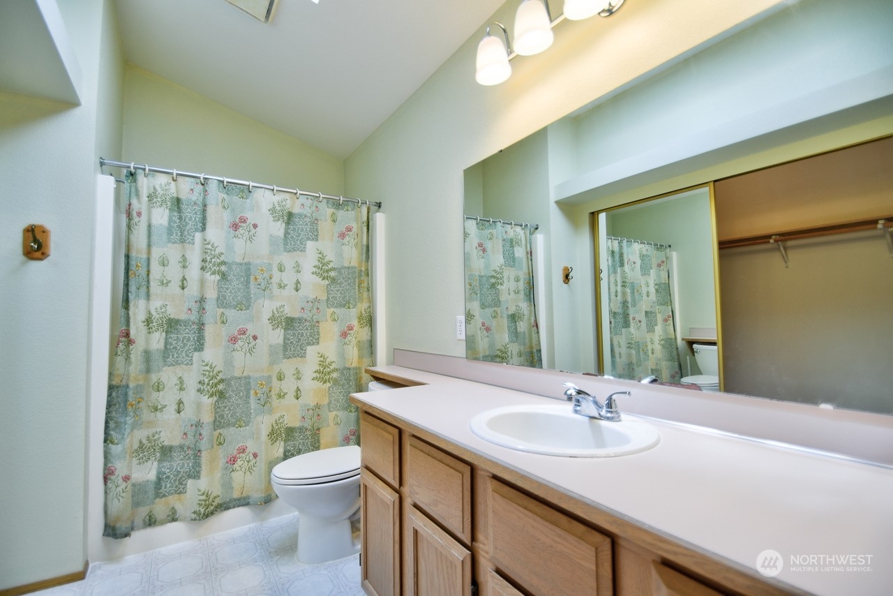 4530 Beckonridge Loop Southeast Lacey, WA 98513 - Photo 16 of 28 a bathroom with a sink toilet and shower