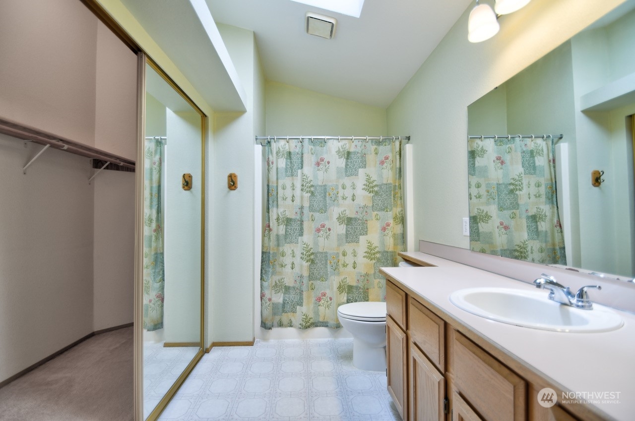 4530 Beckonridge Loop Southeast Lacey, WA 98513 - Photo 17 of 28 a bathroom with a double vanity sink toilet and shower