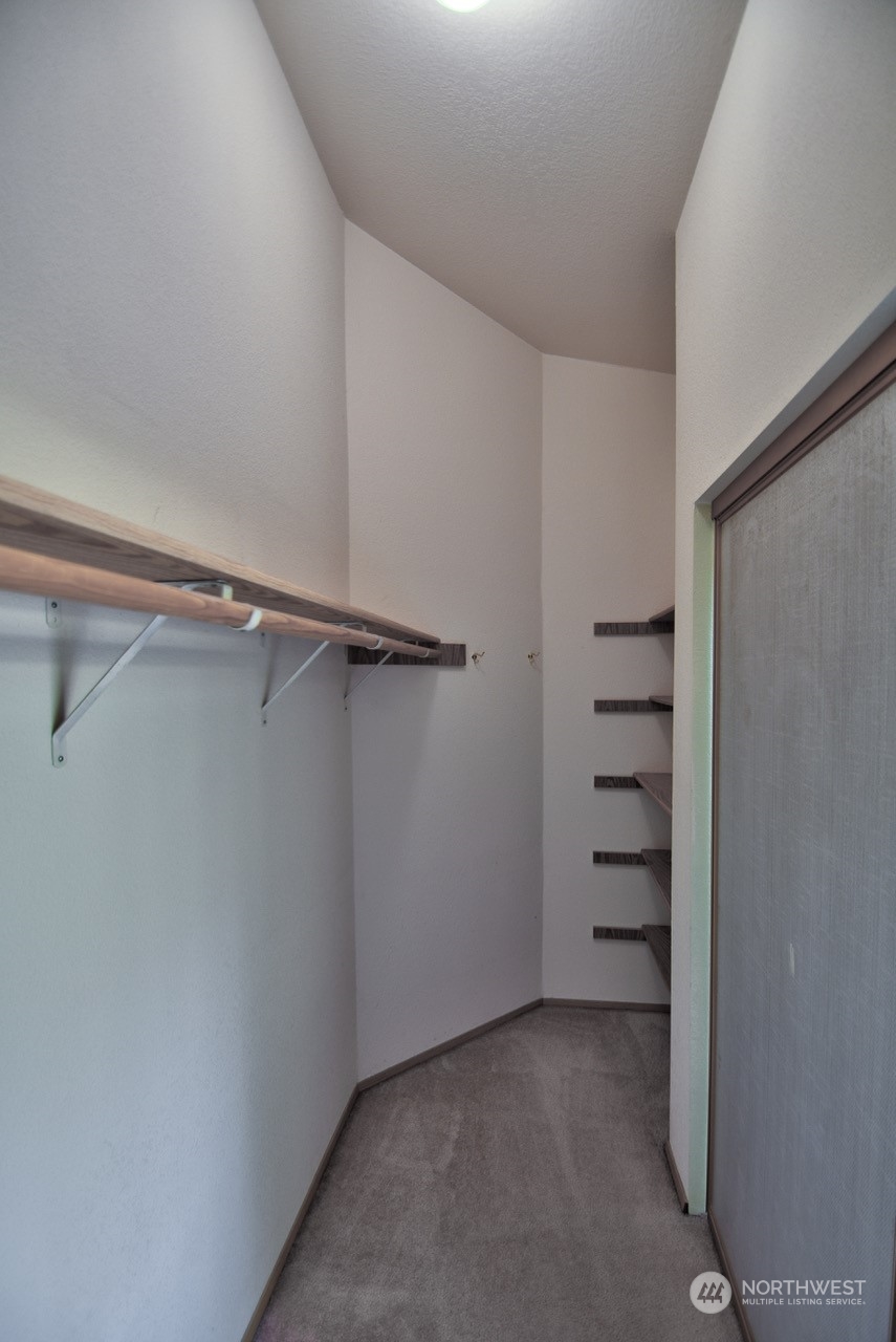 4530 Beckonridge Loop Southeast Lacey, WA 98513 - Photo 18 of 28 a view of walk in closet with empty racks