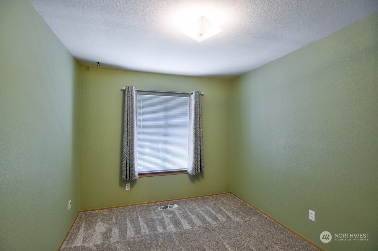 4530 Beckonridge Loop Southeast Lacey, WA 98513 - Photo 20 of 28 an empty room with a window