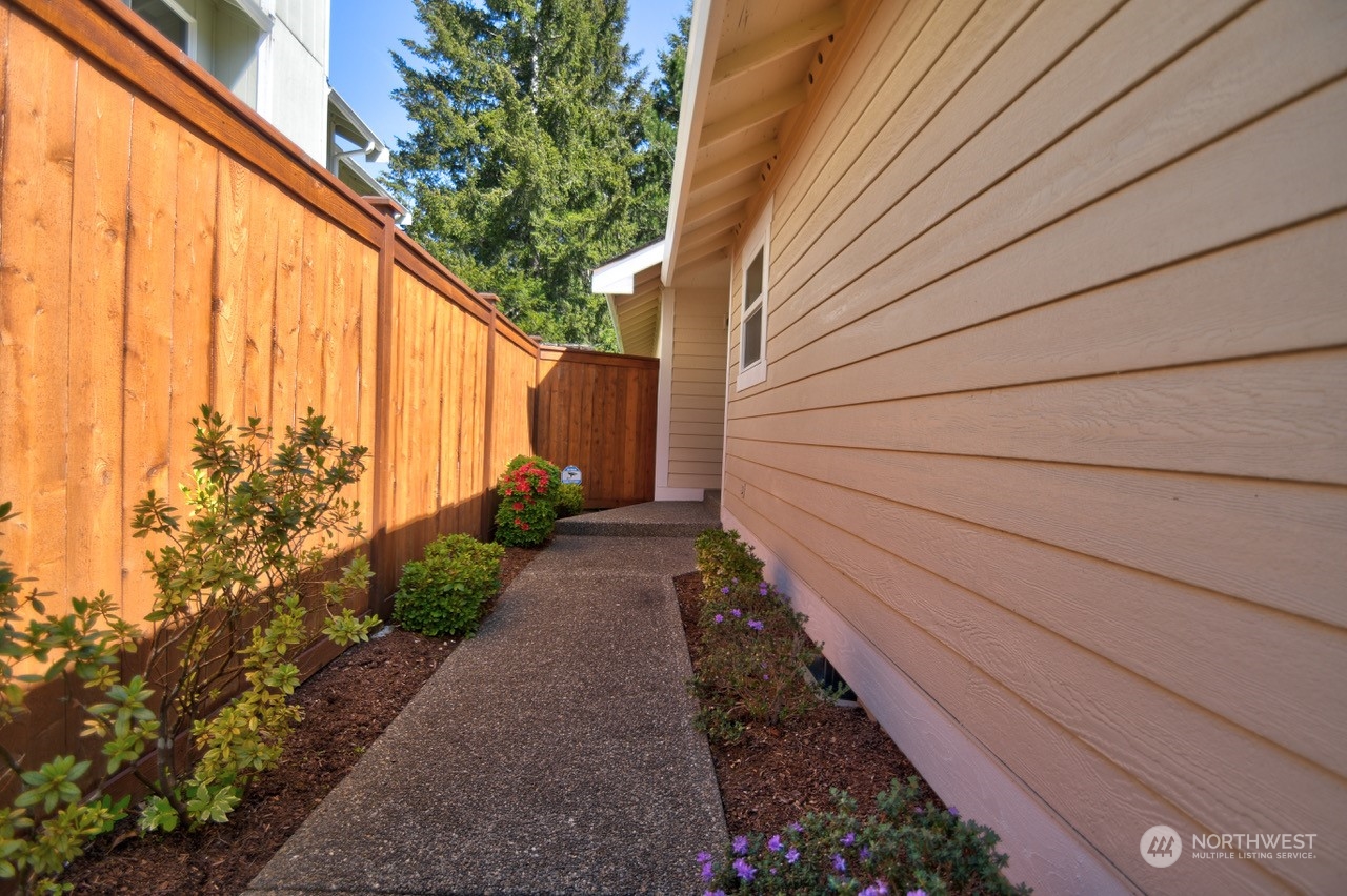 4530 Beckonridge Loop Southeast Lacey, WA 98513 - Photo 2 of 28 a view of a pathway with a flower plants