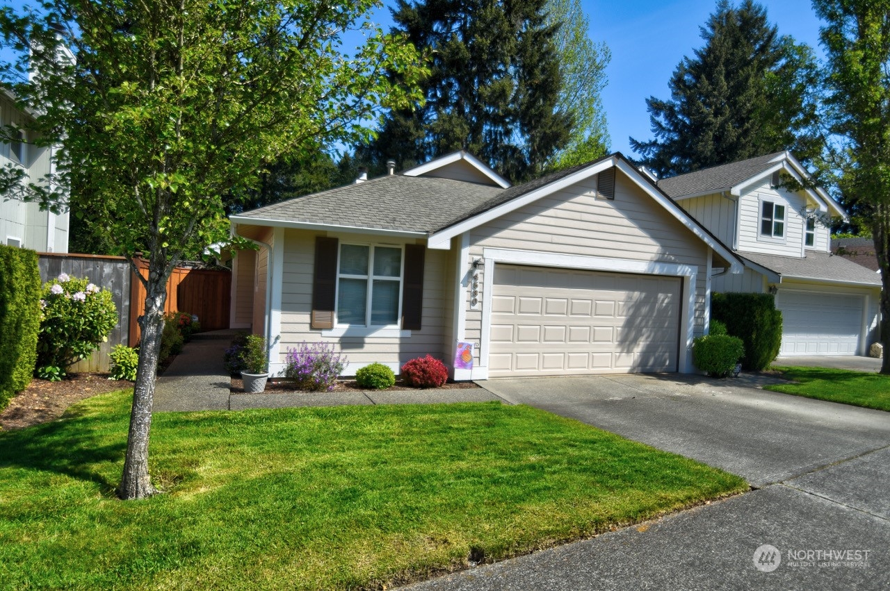 4530 Beckonridge Loop Southeast Lacey, WA 98513 - Photo 28 of 28 a front view of a house with a yard and garage
