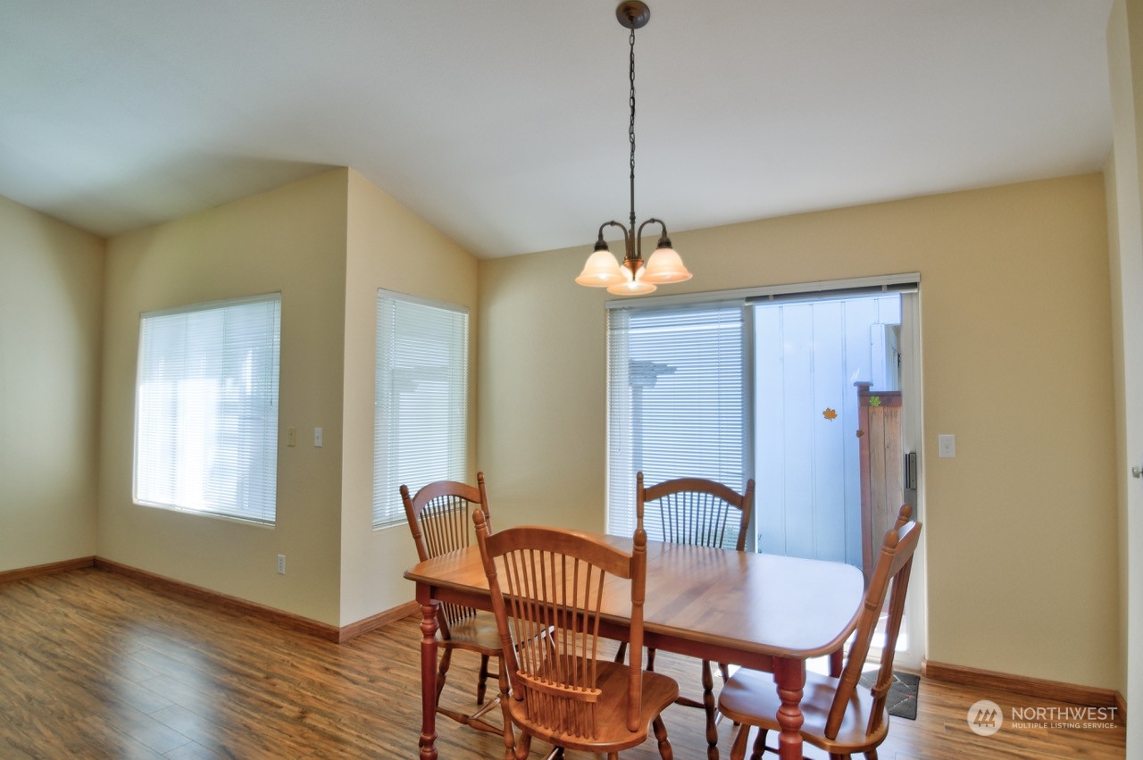 4530 Beckonridge Loop Southeast Lacey, WA 98513 - Photo 9 of 28 a view of a dining room with furniture window and wooden floor
