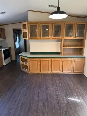a view of a house with wooden floor and a large window