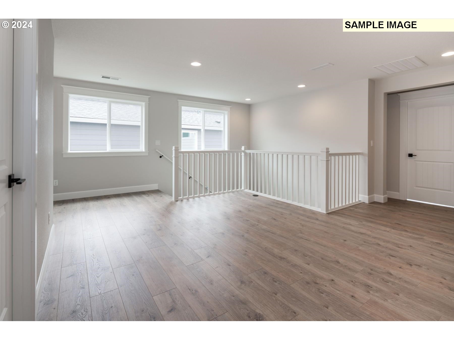 1127 South 46th Place Ridgefield, WA 98642 - Photo 12 of 26 a view of empty room with wooden floor