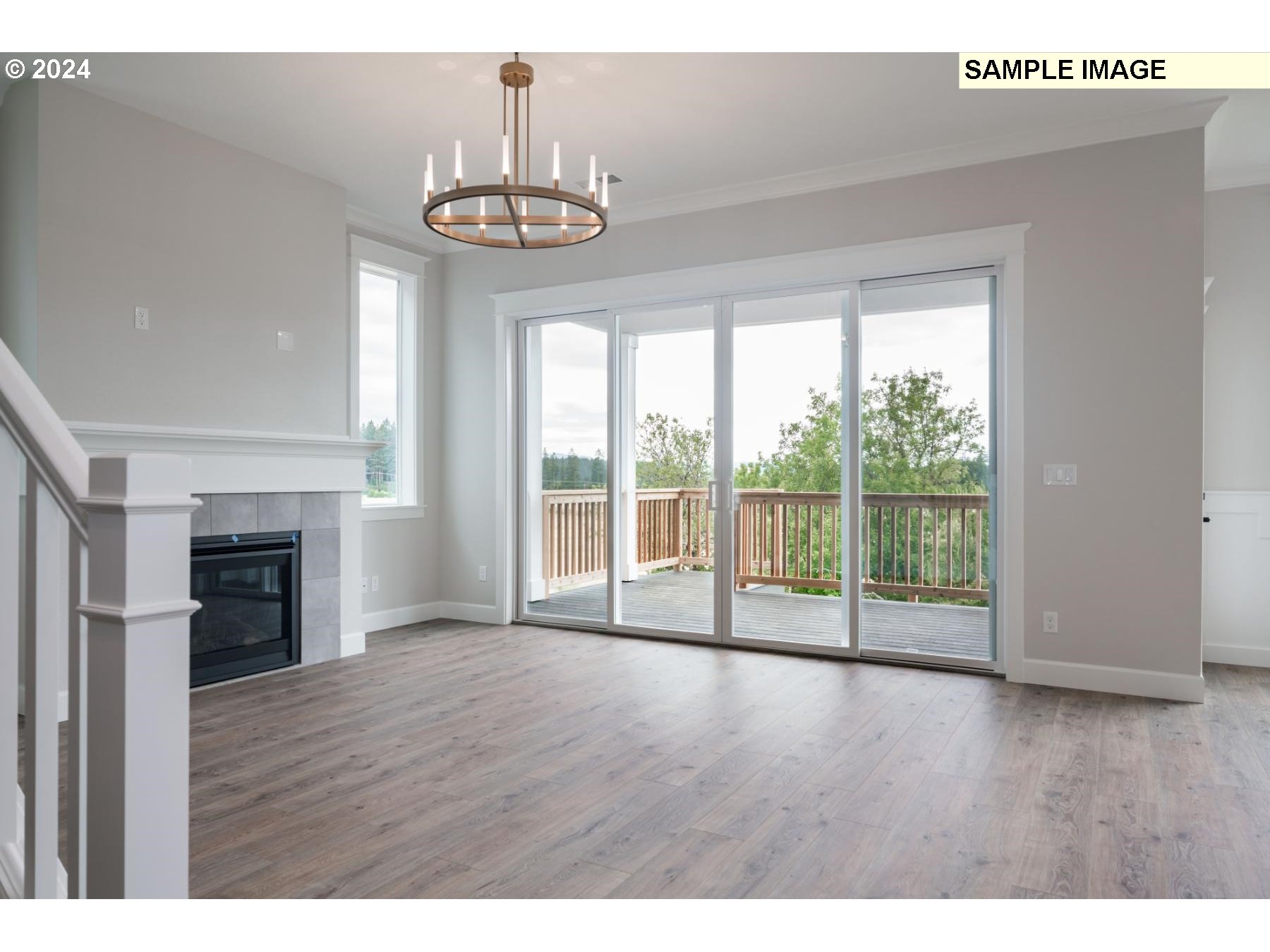 1127 South 46th Place Ridgefield, WA 98642 - Photo 4 of 26 a view of an empty room with wooden floor and a window