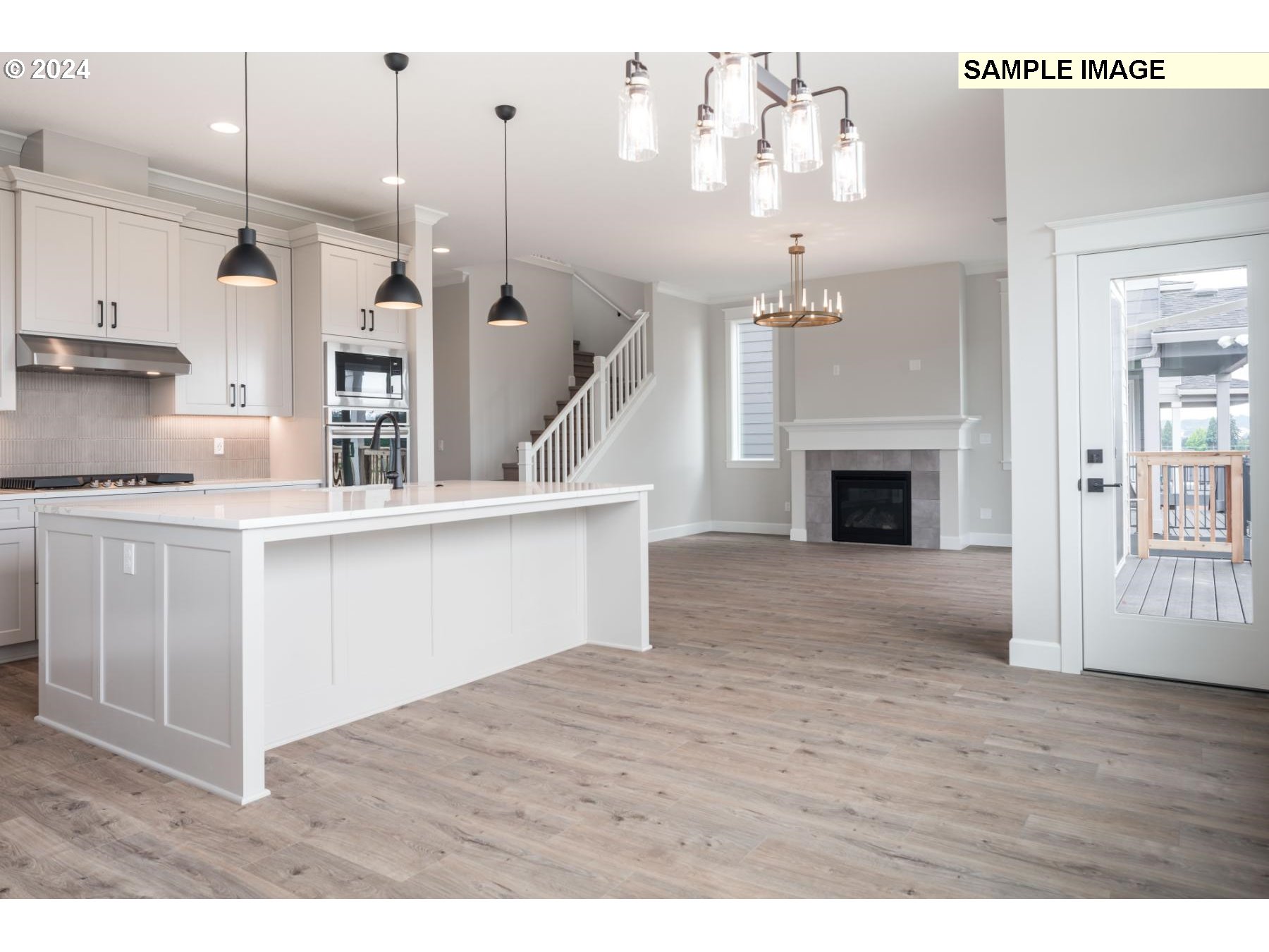 1127 South 46th Place Ridgefield, WA 98642 - Photo 7 of 26 a view of entryway and kitchen with wooden floor