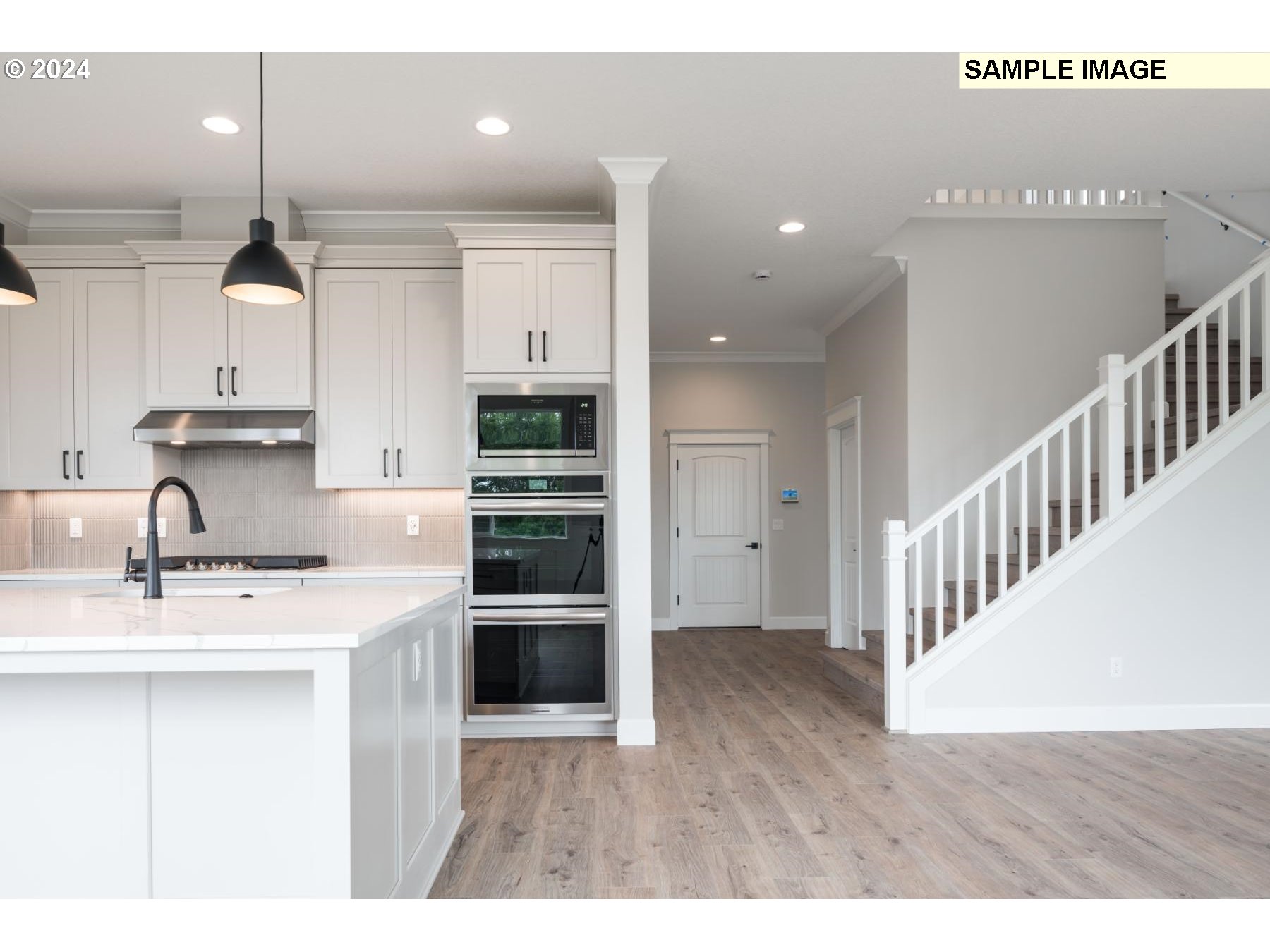 1127 South 46th Place Ridgefield, WA 98642 - Photo 8 of 26 a kitchen with kitchen island a sink stainless steel appliances and cabinets