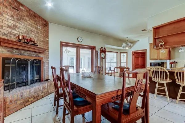 a view of a hallway with entryway windows wooden floor and front door
