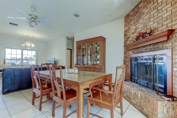 a kitchen with a sink dishwasher and cabinets with wooden floor