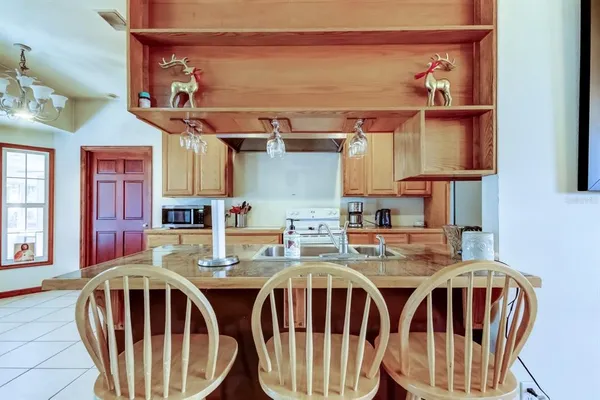 a kitchen with stainless steel appliances granite countertop a sink and cabinets