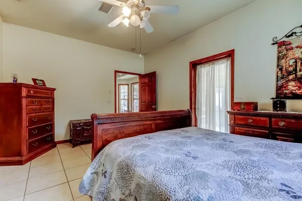 a bathroom with a bathtub and a window