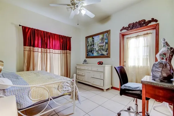 a bedroom with a bed and a dresser