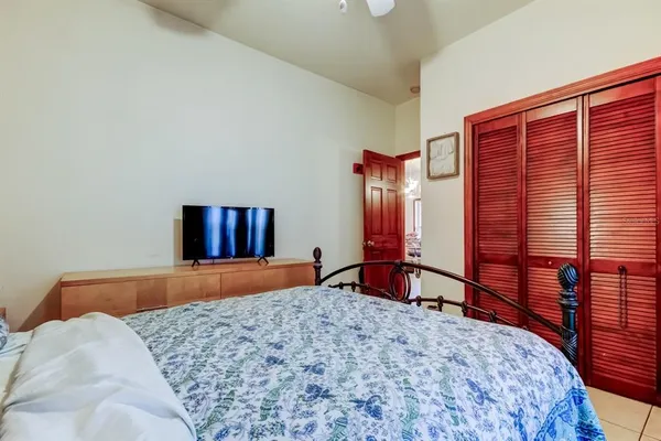 a living room with furniture a dining table and a window