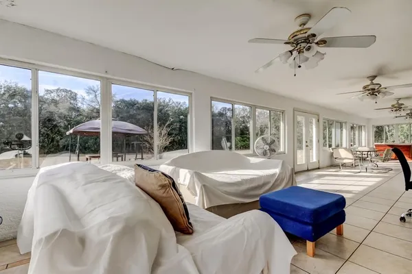 an aerial view of a house with a yard