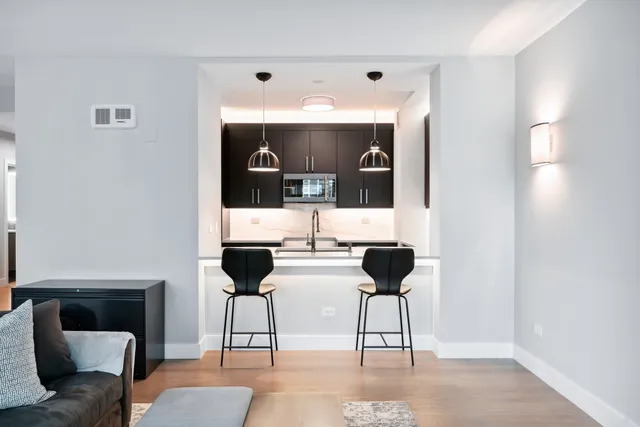 a living room with furniture and a lamp
