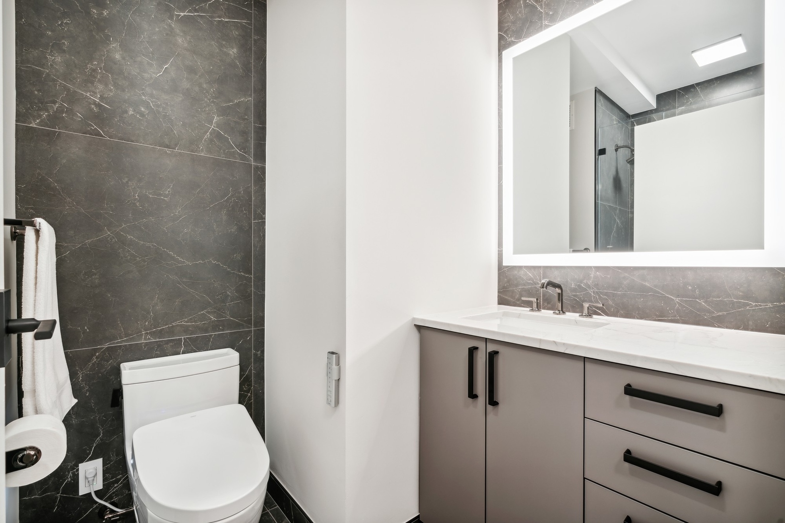 501 North Clinton Street, Unit 2004 Chicago, IL 60654 - Photo 22 of 34 a bathroom with a toilet a sink and mirror