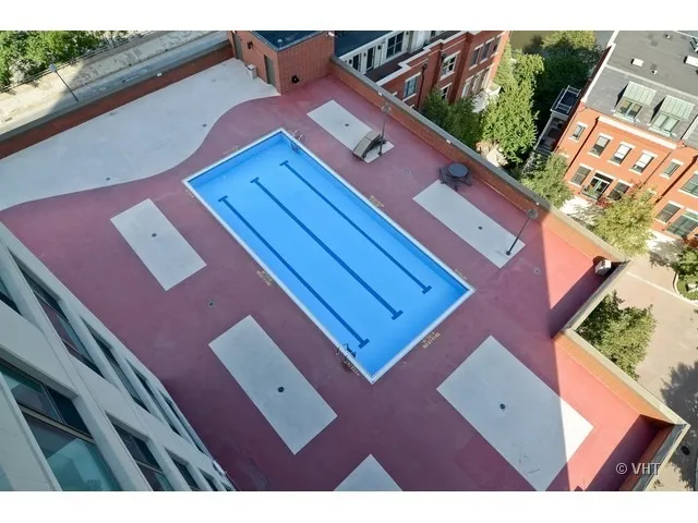 a view of a wooden deck next to a yard