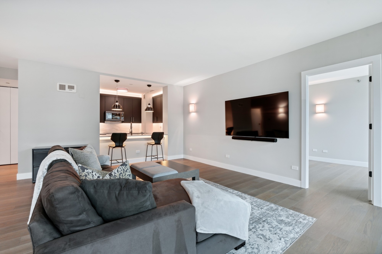 501 North Clinton Street, Unit 2004 Chicago, IL 60654 - Photo 5 of 34 a living room with furniture and a flat screen tv