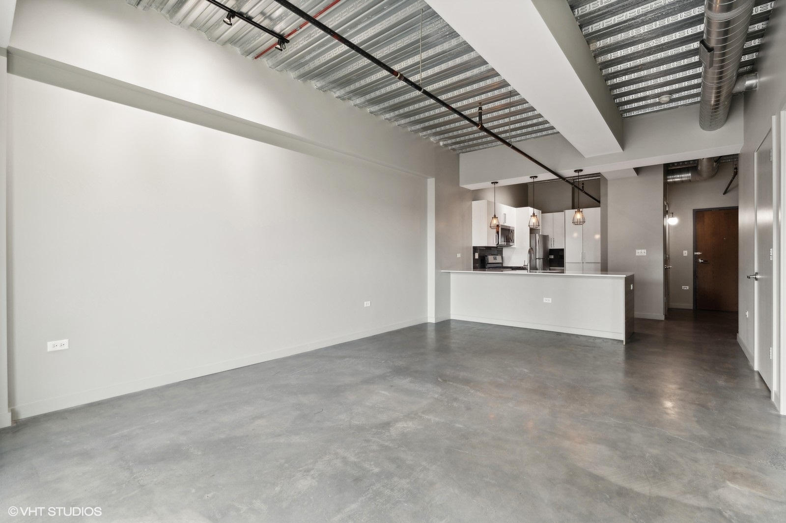 1241 North Milwaukee Avenue, Unit 306 Chicago, IL 60622 - Photo 4 of 14 a view of a livingroom with a fireplace