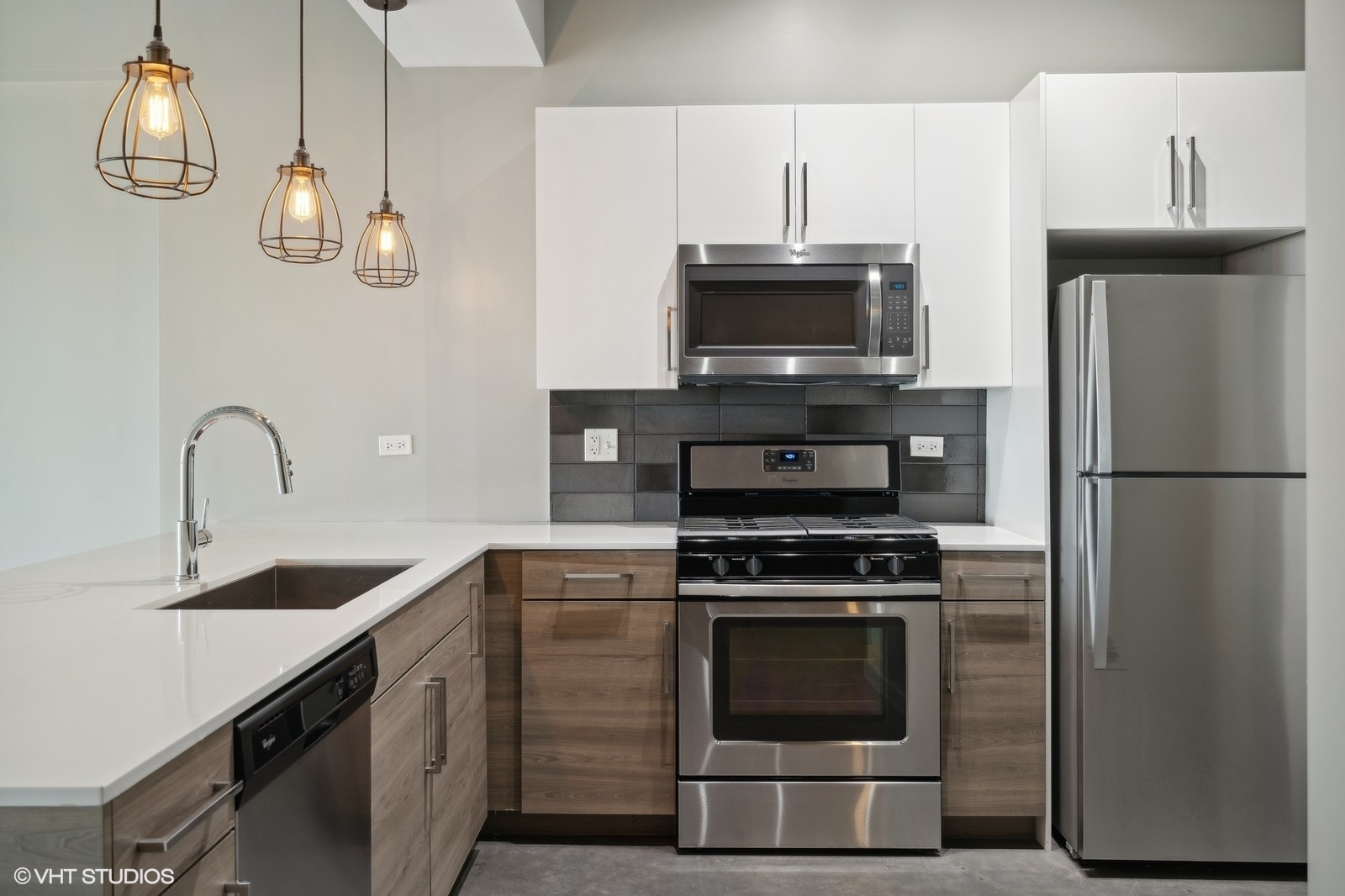 1241 North Milwaukee Avenue, Unit 306 Chicago, IL 60622 - Photo 7 of 14 a kitchen with cabinets stainless steel appliances and a counter top space