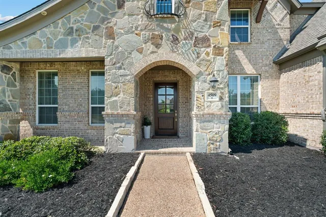 a front view of a house with yard