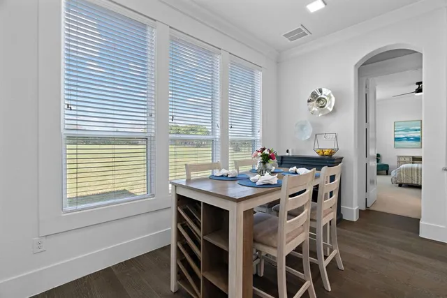 a view of a dining room with furniture and window