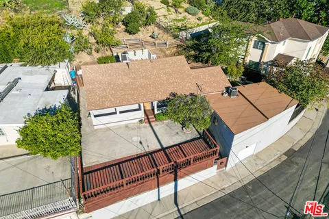 an aerial view of residential house with outdoor space