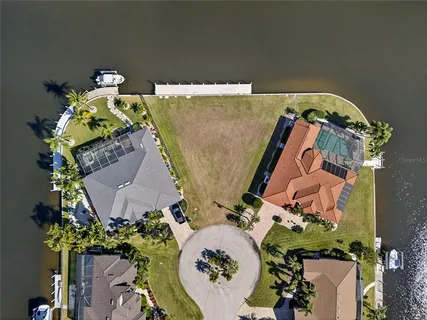 an aerial view of a house with outdoor space