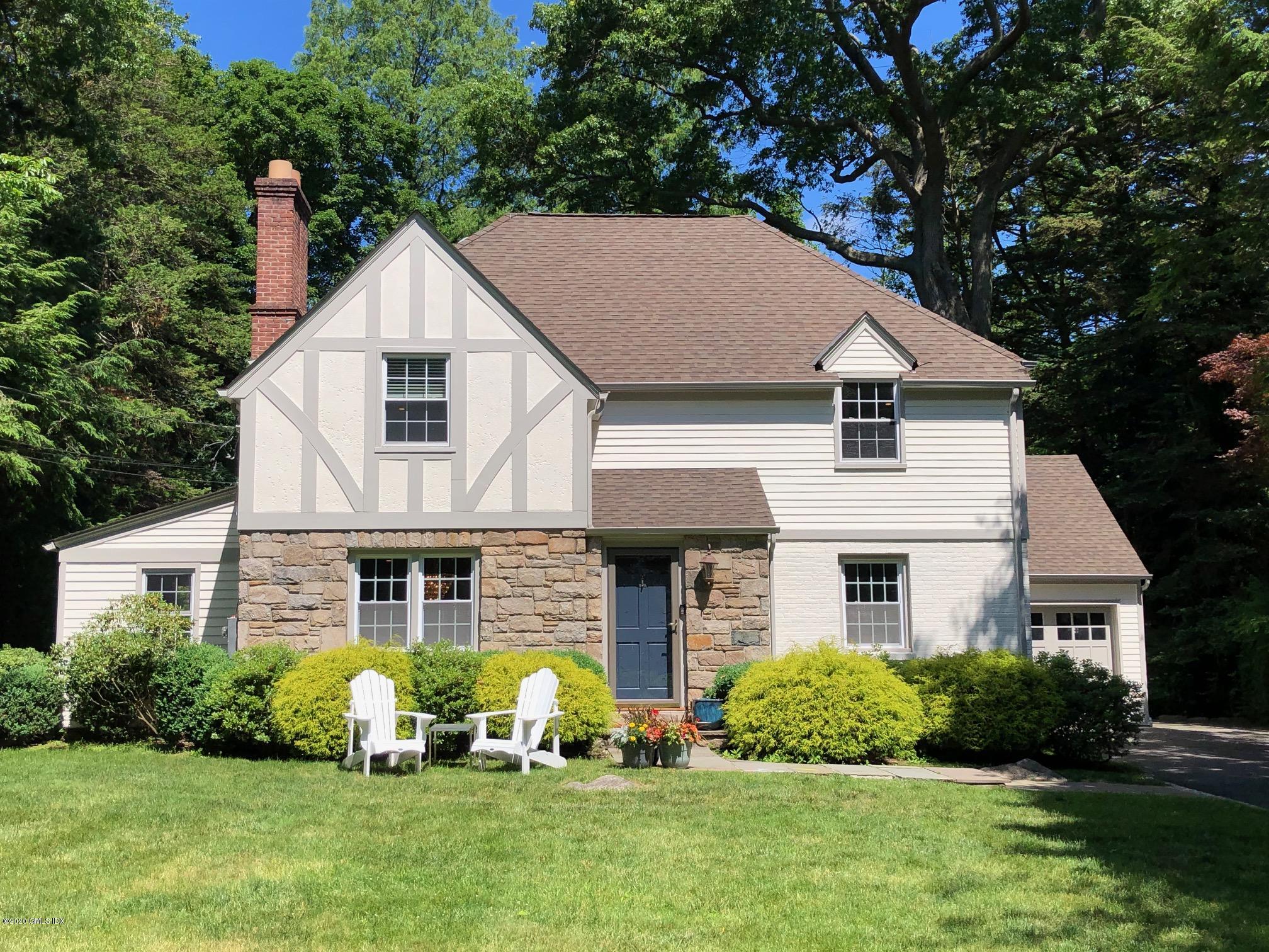 22 Crescent Road Riverside, CT 06878 - Photo 1 of 29 a front view of a house with garden and plants