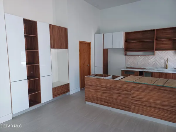 a bedroom with a bed and cabinet