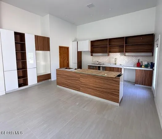 a room with a bed and a flat screen tv