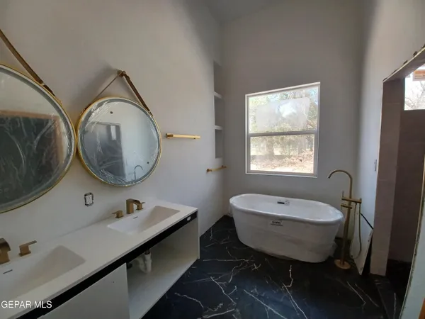 a bathroom with a sink and a mirror
