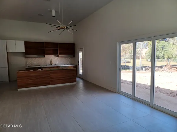 a view of room with wooden floor and window