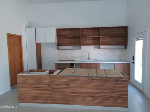 a view of kitchen and wooden floor