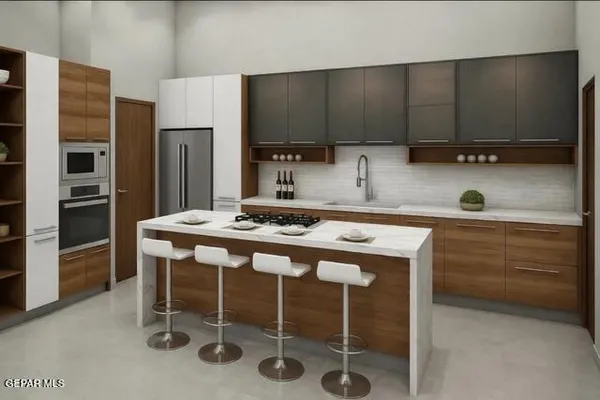 a kitchen with a table chairs refrigerator and cabinets