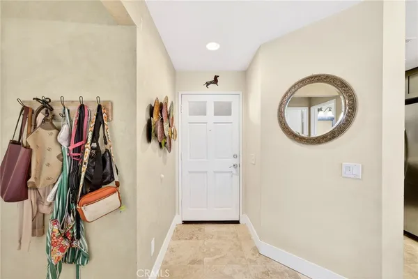 a view of walk in closet with clothes