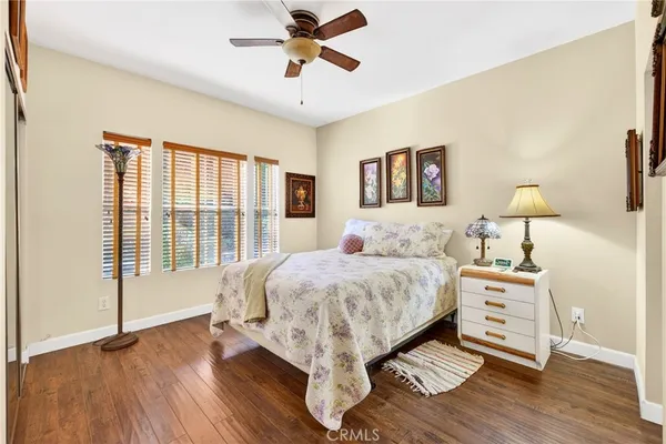 a bed room with a bed and a chandelier