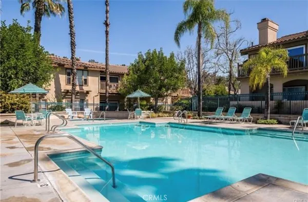 a view of a swimming pool with a lounge chairs