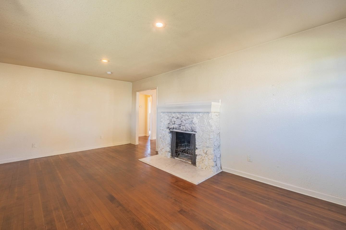 40 Oak Street Salinas, CA 93901 - Photo 6 of 28 a view of a room with wooden floor and a fireplace