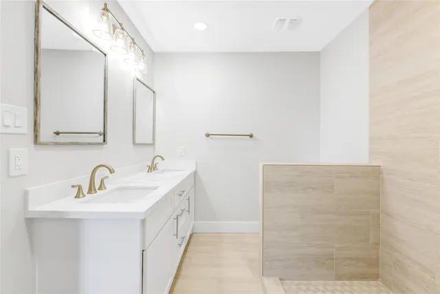 a view of an empty room with window and a ceiling fan