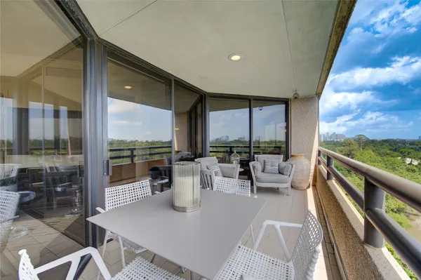 a very nice looking dining room with a large window and a table