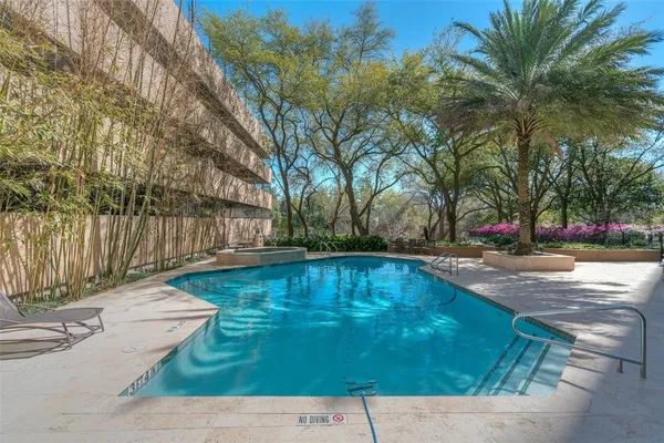 a swimming pool with wooden fence