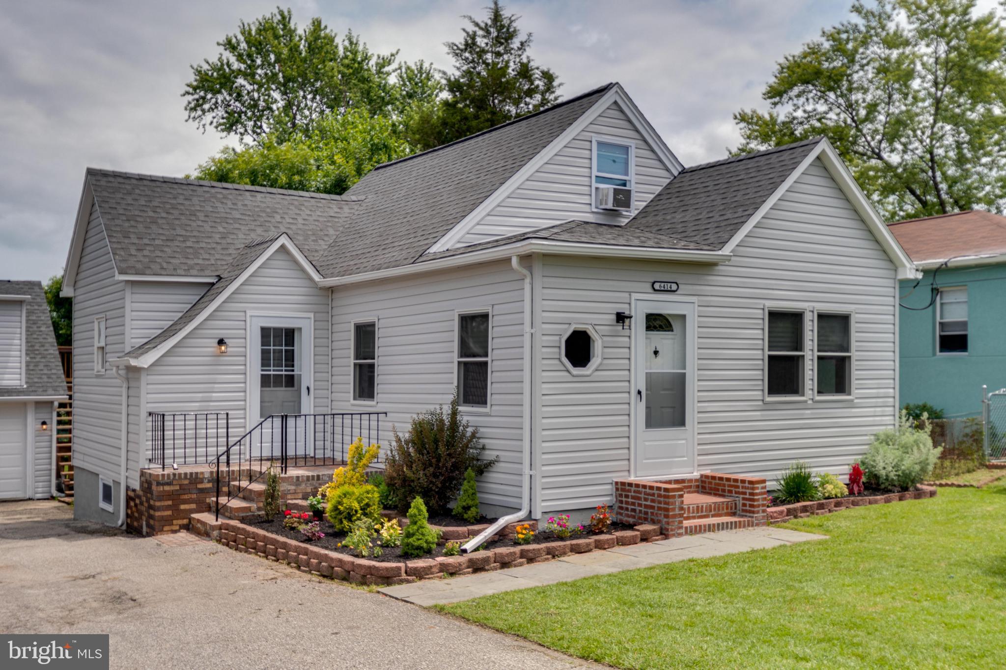 6414 Kenwood Avenue Rosedale, MD 21237 - Photo 2 of 60 a view of a white house next to a yard and a yard