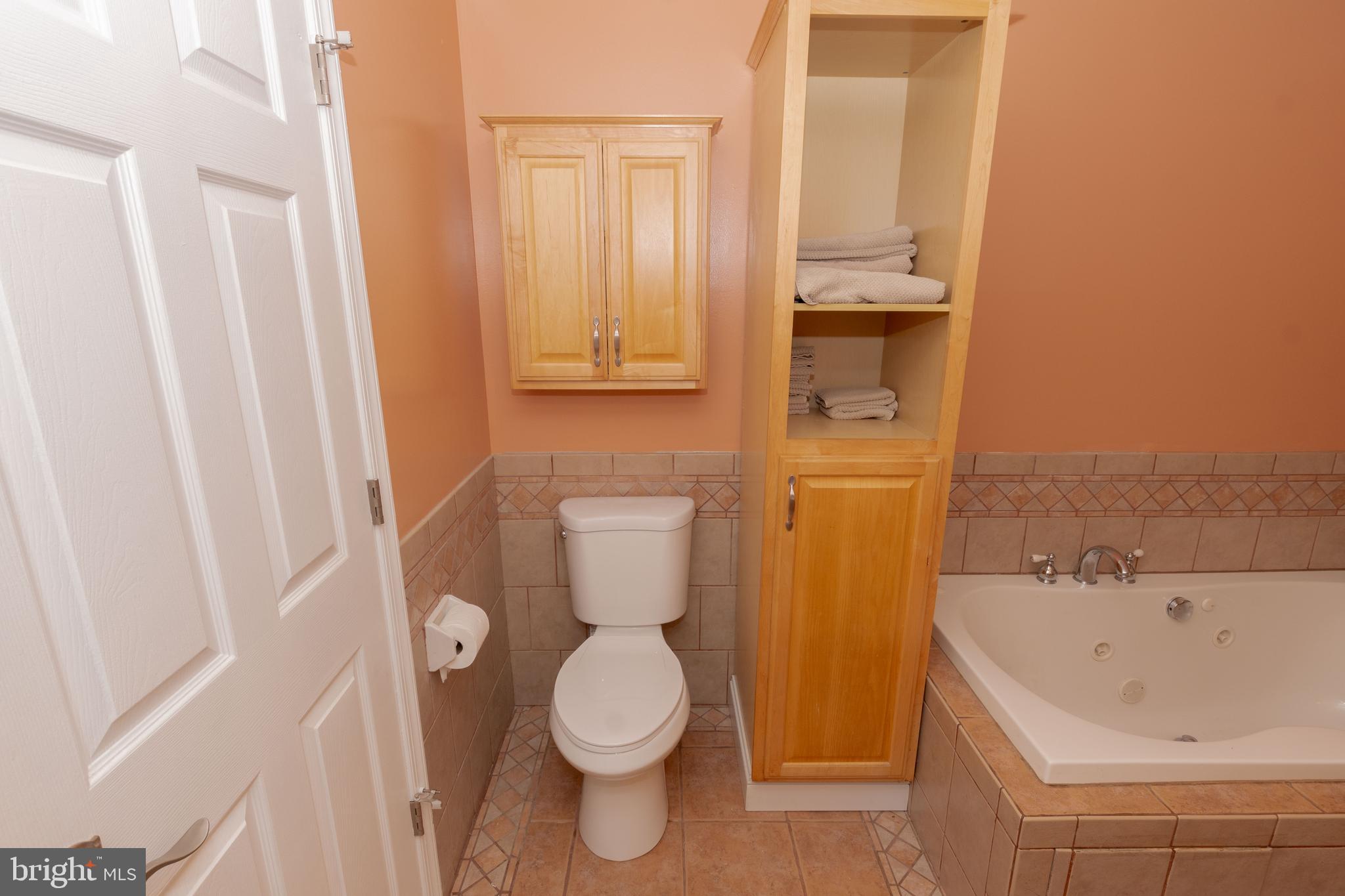 6414 Kenwood Avenue Rosedale, MD 21237 - Photo 24 of 60 a bathroom with a toilet and a bathtub