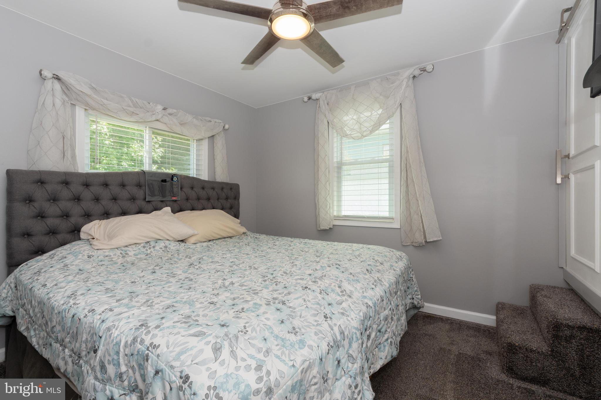 6414 Kenwood Avenue Rosedale, MD 21237 - Photo 25 of 60 a bedroom with a bed and window