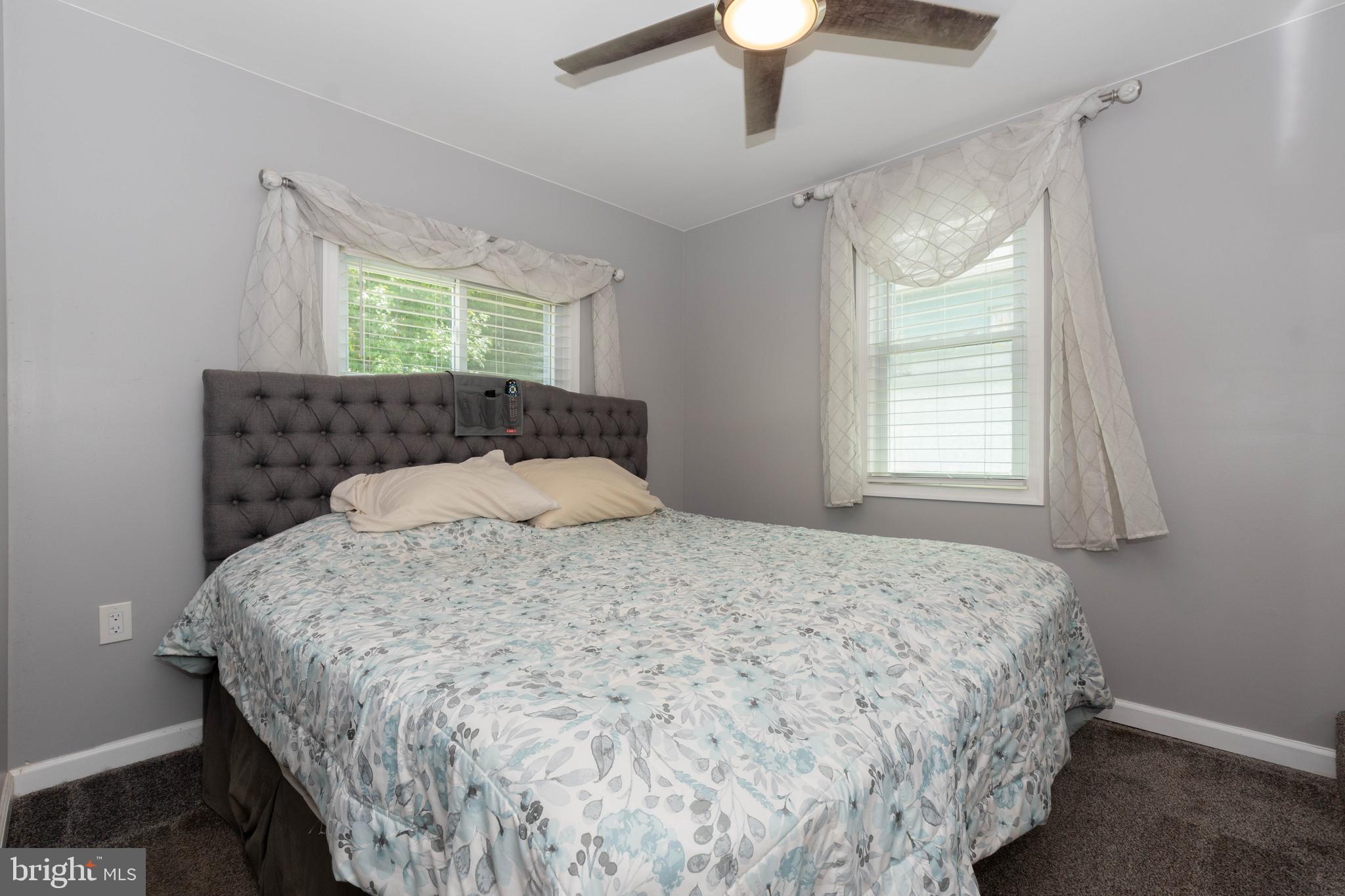 6414 Kenwood Avenue Rosedale, MD 21237 - Photo 26 of 60 a bedroom with a bed and a window
